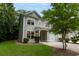 Charming two-story home with well-maintained landscaping, covered porch, and attached garage at 5001 Hay Bale Ct, Summerville, SC 29485