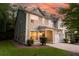 Charming two-story home with a manicured lawn, front porch, and a two-car garage at 5001 Hay Bale Ct, Summerville, SC 29485