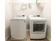 Laundry room area featuring new white front-loading washer and dryer at 5001 Hay Bale Ct, Summerville, SC 29485