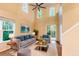 Bright living room boasts high ceilings, large windows, stylish furnishings, and a serene atmosphere perfect for relaxation at 5001 Hay Bale Ct, Summerville, SC 29485