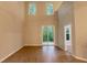 Open-concept living area with laminate flooring and sliding glass doors leading to a serene outdoor space at 5001 Hay Bale Ct, Summerville, SC 29485
