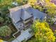 Aerial view of a luxurious home featuring lush landscaping and mature trees at 515 Claret Way, Kiawah Island, SC 29455