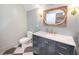 Modern bathroom with a stylish vanity, marble countertop, gold hardware and decoratrive lighting at 515 Claret Way, Kiawah Island, SC 29455