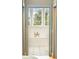 Bright bathroom featuring a soaking tub and large windows at 515 Claret Way, Kiawah Island, SC 29455