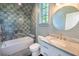 Modern bathroom featuring stylish fixtures, marble countertops, and tiled shower at 515 Claret Way, Kiawah Island, SC 29455