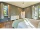 Comfortable main bedroom featuring hardwood floors, and an ensuite bathroom at 515 Claret Way, Kiawah Island, SC 29455