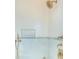 Detailed view of shower with marble tile and gold fixtures at 515 Claret Way, Kiawah Island, SC 29455