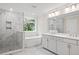 Elegant bathroom with marble floors, a glass-enclosed shower, and double vanity at 5182 Stono Plantation Rd Dr, Hollywood, SC 29449