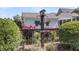 Cozy backyard garden with birdhouse, wooden fence, and beautiful rose bushes, perfect for enjoying nature at 525 Scholar Way, Summerville, SC 29486