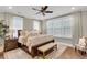 Well-lit bedroom with a large bed, soft colors, and a comfortable seating area at 525 Scholar Way, Summerville, SC 29486
