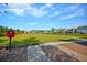 Large grassy community lawn with a 'Connect Here' hotspot sign and neighborhood homes in the distance at 525 Scholar Way, Summerville, SC 29486