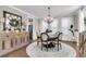 Dining room featuring a chandelier, round table with seating for six, and a buffet at 525 Scholar Way, Summerville, SC 29486