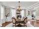 Dining room with wood chandelier and wainscoting at 525 Scholar Way, Summerville, SC 29486