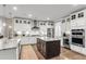 Kitchen with white cabinetry, stainless steel appliances, and a dark wood island at 525 Scholar Way, Summerville, SC 29486