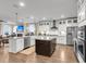 Kitchen showcasing white cabinets, stainless steel appliances, a center island, and an open layout at 525 Scholar Way, Summerville, SC 29486