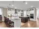 Kitchen showcasing white cabinets, stainless steel appliances, a center island, and an open layout at 525 Scholar Way, Summerville, SC 29486