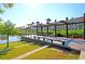Relaxing lakeside deck with seating, offering serene waterfront views in a charming neighborhood setting at 525 Scholar Way, Summerville, SC 29486