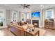 Inviting living room with a fireplace, large windows, and a comfortable leather sofa at 525 Scholar Way, Summerville, SC 29486