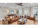 Cozy living room with comfortable leather seating, a jute rug, and ample natural light at 525 Scholar Way, Summerville, SC 29486