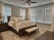 Bright main bedroom with hardwood floors, neutral paint, large windows and stylish furnishings at 525 Scholar Way, Summerville, SC 29486