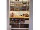 Walk-in pantry with wood counters, white subway tile, and organized storage baskets and containers at 525 Scholar Way, Summerville, SC 29486