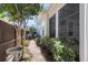 Charming side yard pathway with mature landscaping and a stone birdbath at 525 Scholar Way, Summerville, SC 29486
