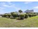 Street view of charming homes in a community with well-maintained lawns and mature landscaping on a sunny day at 525 Scholar Way, Summerville, SC 29486