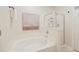 Bright bathroom featuring a separate bathtub, a glassed-in shower, and a towel hanger at 543 Mclernon Trce, Johns Island, SC 29455