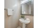 Charming powder room features a pedestal sink, decorative mirror, and neutral wall color at 543 Mclernon Trce, Johns Island, SC 29455