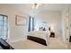 Bright bedroom with high ceilings, a ceiling fan, light carpet and access to the porch at 543 Mclernon Trce, Johns Island, SC 29455