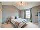 Bedroom with carpet, a ceiling fan, a large window, and gray walls at 543 Mclernon Trce, Johns Island, SC 29455