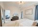 Bedroom features carpet, a ceiling fan, a large window, and access to the bathroom at 543 Mclernon Trce, Johns Island, SC 29455