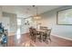 Open-concept dining area showcasing hardwood floors, with easy access to kitchen at 543 Mclernon Trce, Johns Island, SC 29455
