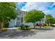 Well-maintained townhomes with attached garages and mature trees at 543 Mclernon Trce, Johns Island, SC 29455