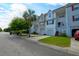 Street view of townhomes, each with an attached garage and landscaped yards at 543 Mclernon Trce, Johns Island, SC 29455