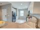 Well-lit kitchen with white cabinets, stainless steel appliances, and neutral countertops at 543 Mclernon Trce, Johns Island, SC 29455