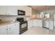 Well-lit kitchen featuring white cabinets, modern appliances, and countertops at 543 Mclernon Trce, Johns Island, SC 29455