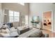 Bright living room with vaulted ceilings, comfortable sectional sofa, and access to a bedroom at 543 Mclernon Trce, Johns Island, SC 29455