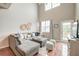Bright and airy living room with vaulted ceilings, windows, and a cozy sectional sofa at 543 Mclernon Trce, Johns Island, SC 29455
