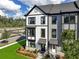 Modern townhomes with attractive landscaping and coordinated exterior colors at 556 Scholar Way, Summerville, SC 29486