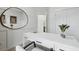 Modern office space with white desk, decorative round mirror, and panelled accent wall at 556 Scholar Way, Summerville, SC 29486