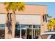 Exterior of the Southern Cities Boutique, accented by a palm tree and ample storefront windows at 556 Scholar Way, Summerville, SC 29486