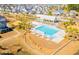 Aerial view of a neighborhood pool with cabanas and palm trees at 562 Scholar Way, Summerville, SC 29486