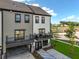 Rear view of new townhomes featuring balconies, garages, and blue accessible parking at 562 Scholar Way, Summerville, SC 29486