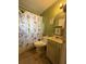 Bathroom features an alphabet shower curtain and basic fixtures at 715 Yew St, Charleston, SC 29407