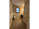 Functional bathroom featuring a toilet, vanity, and neutral tile flooring and wallpaper at 715 Yew St, Charleston, SC 29407