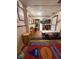 Classroom with colorful carpet, tables, and chairs, with educational decorations and storage at 715 Yew St, Charleston, SC 29407