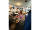 Interior view of room with educational rug, tables, chairs, and colorful wall decorations at 715 Yew St, Charleston, SC 29407
