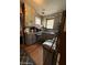 Galley kitchen featuring wood-look floors, compact appliances, and functional storage solutions at 715 Yew St, Charleston, SC 29407