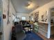 Office space featuring desk, chair, filing cabinet, and natural light from windows and brick accent wall at 715 Yew St, Charleston, SC 29407